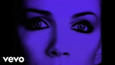 a woman's face with purple light in the background and an image of her eyes