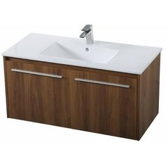 a white sink sitting on top of a wooden cabinet next to a faucet