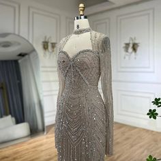 a dress is displayed on a mannequin in a room