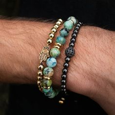 The Instanbul stack features trifecta of symbolic beaded bracelets - Blue Turquoise, CZ Orb and CZ Eye in Gold Black PVC for a triple style treat. Ready to rock any time of day (or night!), Instanbul Stack keeps you protected as you go about your day. Indulging the adventurous spirit and wandering heart that lives within all of us, our men's bracelet stacks have been crafted to provide a touch of class to your wardrobe throughout the year. Each exquistely curated stack includes a mix of spiritua Male Beaded Bracelets, Men’s Bracelet Designs, Men Bracelet Design, Men Beaded Bracelet Ideas, Bracelets Drawing, Spiritually Healing, Male Bracelets, Men Beaded Bracelet, Mens Bracelet Fashion