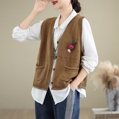 Details: Item: Autumn V-neck Pockets Cotton Knitted Vests Fabric: Cotton Collar: V-Neck Pattern: Solid Color Color: Beige, Khaki, Caramel, Green, Coffee, Black Style: Classic, Loose Size Bust Length Shoulder cm inch cm inch cm inch One Size 108 42.52 54 21.26 38 14.96 Casual Brown Knit V-neck Sweater, Casual Brown V-neck Sweater For Work, Casual Brown Knitted Sweater Vest, Brown V-neck Sweater Vest For Winter, Fall Casual V-neck Sweater Vest, Brown Sweater Vest For Work In Spring, Casual V-neck Sweater Vest For Fall, Brown Knitted V-neck Top, Casual Brown V-neck Sweater For Layering