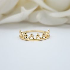 Adorable solid 14k yellow gold Crown Ring. Perfect to wear everyday and everywhere. Unique, elegant and everlasting. A must have in your gold collection. 14k gold will not tarnish or rust. Perfect for her. Materials: 14k Gold Sizes: 5 to 12 US Weight: 1.5 grams  ( aprox, depending on the size) Band width: 1.5mm Crown widht: 4.5mm 14k Stamped Brand new Fast shipping Briza Collections is a small family owned business that works hard on providing the best selection of Fine Solid Gold Jewelry for th Gold Crown Ring, Crown Ring, Gold Crown, Solid Gold Jewelry, Ring Dainty, Gold Collection, Small Family, Stackable Rings, Gold Bands