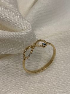 "ABOUT PRODUCT This 14K Gold Infinity with Evil Eye is beautifully designed and hand crafted with our associates to make this a special gift for your loved ones. Knowing the value of our customers, We prepare each piece with extra care and attention.  ITEM DETAILS Material: 14K Gold Approx:  1.00 gram Available colors: Gold, Rose Gold, White Gold Available Sizes: 4 US to 11 US  ✪ 14k Solid Gold ( Certification will be included with your order ) ✪Available 14K White, Yellow, Rose Gold (also in 10 Elegant Evil Eye Rings As Gift, Gold Open Ring With Evil Eye, Gift Open Ring With Evil Eye Detail, Gold Evil Eye Ring Gift, Adjustable Evil Eye Rings, Evil Eye Ring Gold, Eternity Symbol, Gold Infinity Ring, Cute Gifts For Her