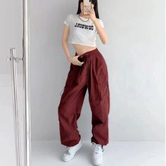 Features: Introducing the Women Punk Cargo Pants, perfect for the fashion-forward. Designed with a high waist and wide leg, these pants not only provide a flattering fit but also add a touch of streetwear edge to your wardrobe. Made with lightweight material, these pants are perfect for the summer season. Upgrade your style with these American Retro-inspired trousers. Fall Y2k High-waisted Pants, High Waist Cargo Pants For Streetwear, Trendy High-waisted Pants For Streetwear, Trendy High-waisted Streetwear Pants, Trendy Baggy Wide Leg Pants, Trendy High-waisted Bottoms For Streetwear, Trendy Wide-leg Pants, Baggy High Waist Parachute Pants In Urban Style, High-waisted Techwear Pants For Streetwear