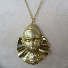 80s gold tone clown/mime pendant. Nice and chunky. It is a bit heavy, pendant weighs 50 grams, so that is the weight of 10 nickels, for reference Total length 18"  Pendant is 2-3/4 x 1-3/4" Deadstock with no real flaws but for a few tiny marks seen up close, result of slight design flaw New Wave, Chains Necklace, Favorite Jewelry, Gold Tones, Drama, Jewelry Necklaces, Accessory Gift, Electronic Accessories, Purses And Bags