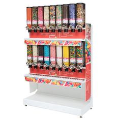 a candy machine with lots of sprinkles on it's display shelf