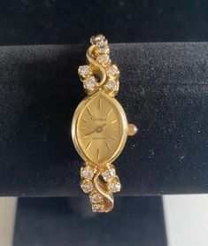 14kt white & yellow gold Geneve quartz watch that weighs 18.7 grams with movement the watch has 12 round brilliant cut Diamond G-H in color and SI clarity. Total weight of diamonds is 1 carat. Appraisal is in photos. Anniversary Diamond Watch In Yellow Gold, Anniversary Yellow Gold Diamond Watch With Accents, Gold Diamond Jewelry And Watches For Evening, Gold Diamond-accented Watch For Evening, Gold Watches With Diamond Accents For Evening, Gold Diamond Watch With Diamond Accents For Evening, Gold Evening Watches With Diamond Accents, Gold Diamond Accented Watch For Evening, Gold Diamond Watch For Wedding