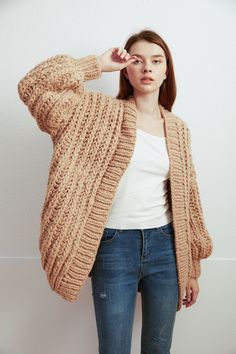 "Oversize sweater give you super warm and stylelish looking! Feastures: * open front cardigan * oversize looking * drop-shoulder sleeves * Super chunky yarn - 70% wool/ 30% acrylic blended Size: S(us 0-4) M(us 6-8) L(us 10-12)XL(14-16). Pls. choose size and color options. Measurements: size S/M: chest 51\"(130cm), length- 28\"(72cm) Size L/XL: chest 55\"(140cm), length - 30\"(76cm) If you want it in different size or measurements, pls. leave the note or convo me. Hand wash in cold water and lay Cozy Oversized Acrylic Cardigan, Oversized Cozy Acrylic Cardigan, Slouchy Chunky Knit Fall Cardigan, Slouchy Chunky Knit Cardigan For Fall, Trendy Oversized Cable Knit Sweater Coat, Oversized Cozy Acrylic Sweater Coat, Trendy Acrylic Chunky Knit Sweater Coat, Trendy Oversized Knitted Cardigan, Trendy Chunky Knit Sweater Coat