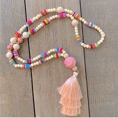 Bead And Tassel Handmade Necklace. Nwot Adjustable Wooden Beaded Necklace For Parties, Pink Beaded Necklaces For Festivals, Pink 8mm Beads Jewelry For Beach, Festival Pink Necklaces With Colorful Beads, Long Pink Beaded Necklace With Faceted Beads, Pink Beaded Necklace For Beach, Festival Pink Beaded Necklace, Pink Wooden Beaded Necklaces For Gifts, Pink Wooden Beads Necklace For Gift