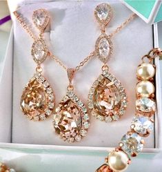 "* Blush Pink AAA Swarovski® Morganite Statement Wedding Jewelry Set...enjoy exquisite elegance and brilliance for your memorable Day! * Brilliant CZ Teardrop Earrings, a 9mm Swarovski® CZ Connector and a gorgeous dangling 18mm Swarovski® Blush Pink Teardrop Pendant. Each vibrant Blush Pink Teardrop is surrounded by many Swarovski Clear Rhinestones. * you are welcome to select any other color of the Swarovski stones if you wish * The total length of each Morganite Earring is 2 1/4\" (58mm). * Se Rose Gold Jeweled Wedding Jewelry, Rose Gold Wedding Jewelry With Jewels, Elegant Champagne Jewelry For Gift, Wedding Rose Gold Jewelry With Jewels, Elegant Champagne Wedding Jewelry, Elegant Champagne Dangle Jewelry, Champagne Crystal Jewelry For Wedding, Vintage Rose Gold Jewelry For Wedding, Champagne Crystal Wedding Jewelry