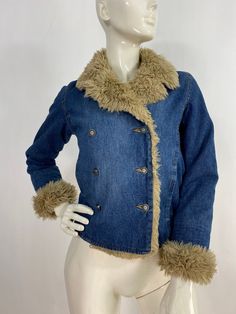 "Warm denim jacket, vintage denim jacket, women's size small Measurements:  Shoulder 16\"/sleeve(uncuffed)22\"/bust (armpit-armpit)17\"/waist 16\"/bottom width 16.5\"/length 20\" Mannequin measurements:  5'8\", bust 34\", waist 25\", hip 33\" Please note that vintage clothing sizes can vary greatly.  The Measurements provided  are approximate and are taken lying flat.  I suggest taking a similar garment from your wardrobe and measure it while lying flat.  This way you can compare measurements.  All of our pieces are genuine vintage. Don't forget to enlarge the photos and take a closer look at this genuine vintage item!! I will ship your item off within 1-2 business days. I ship expedited for all Canadian and US orders. All other destinations world wide will be shipped surface and therefore 70s Denim Puffy Coat, Fitted Dark Wash Jeans For Winter, Winter Blue Jeans With Button Closure, Fitted Denim Winter Outerwear, Winter Fitted Denim Outerwear, Winter Washed Denim Collared Jacket, Denim Blue Winter Outerwear With Buttons, Winter Denim Blue Outerwear With Buttons, Washed Denim Blue Jacket For Winter