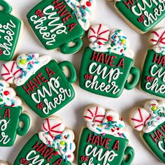 decorated cookies are arranged in the shape of coffee mugs and have words on them