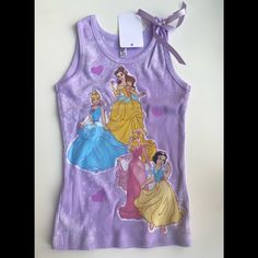 Impossible To Find! Brand New With Tags Girls Tee-Hee Embellished Princess Tank Tops With Bow On Shoulder. Purchased From A Local Boutique- These Aren’t Available Online And Sell Out Within Days Of Becoming Available. Purchased For My Daughters But Never Worn. Sizes Available - 4 Years And 6 Years. (M1) Character Print Cotton Tops, Cartoon Print Tops For Sleepover, Spring Season, Cartoon Print Tops For Sleepover In Spring, Cartoon Print Tops For Spring Sleepover, Spring Cartoon Print Tops For Sleepover, Cute Sleeveless T-shirt For Playwear, Spring Playwear Tops With Character Print, Spring Character Print Tops For Playwear, White Character Print Top For Sleepovers