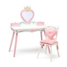 a toy desk and chair with a heart shaped box on it's back end