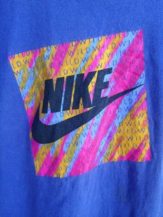 "Vintage Nike wild grey tag t shirt Made in Usa SIZE : XL (PLEASE CHECK THE MEASUREMENT BELLOW) ARMPIT TO ARMPIT : 21.5\" LENGHT : 30\" CONDITION : Used and good condition (8/10) MATERIAL : 100%cotton SHIPPING : I will be ship after received a payment and give tracking numbers. After 7 - 14 Working Days of Shipping from Malaysia please check & give your tracking number parcel to your national post. Receiving the parcel within 7-14 working days. Please contact to me with any questions Thank y 90s Inspired Blue T-shirt With Letter Print, Multicolor Logo Print T-shirt For Streetwear, 90s Style Blue T-shirt With Text Print, 90s Inspired Multicolor T-shirt For Streetwear, 90s Inspired Blue Tops With Letter Print, Blue Grunge Top With Graphic Design, Blue Grunge Graphic Design Tops, Multicolor Letter Print Grunge T-shirt, Multicolor Grunge T-shirt For Streetwear