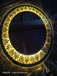 a round mirror sitting on top of a table