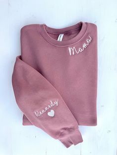 "Mauve Mama Sweatshirt with Kid's Names on the Sleeve is the perfect gift for Moms, Grandmas or Aunties!  Bella + Canvas sweatshirts are excellent quality and the stitching around the collar and on the sleeve comes out looking neat and crisp every time.  About the sweatshirt: *Bella + Canvas Sponge Fleece Drop Shoulder Crewneck Sweatshirt *Airlume combed and ringspun cotton/polyester fleece *52% cotton, 48% polyester  *Drop shoulder *UNISEX sizing - please note that these are not women's sizes; Gift Cotton Sweater With Custom Embroidery, Custom Embroidered Cotton Sweater As Gift, Relaxed Fit Top With Embroidered Text For Gift, Custom Embroidery Cotton Sweater As Gift, Embroidered Logo Sweatshirt As A Gift, Long Sleeve Sweatshirt With Embroidered Logo Gift, Custom Embroidery Sweatshirt As Fall Gift, Winter Gift Tops With Embroidered Logo, Fall Custom Embroidery Sweatshirt Gift