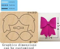 a wooden stamp with a pink bow on it and the words graphics dimensionals can be customized