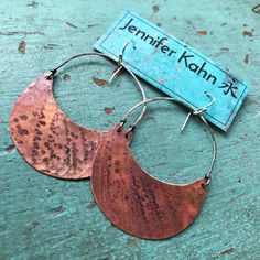 "These are my most popular design! The color on the copper is due to the Flame-patina, which is a spontaneous process and allows for an array of red/orange colors patterns, no two are exactly alike. They are hammered and suspended from sterling wire. Bold yet lightweight and so versatile, great with a dress or jeans. Check out my shop to see this design in other sizes and metals. Crescent measures 2\" wide Sterling silver ear wires" Artisan Orange Copper Earrings, Brown Hammered Copper Earrings, Artisan Red Copper Earrings, Copper Jewelry Diy, Torch Fired Enamel Jewelry, Enameling Jewelry, Pendulum Earrings, Aluminum Earrings, Burlington Vt