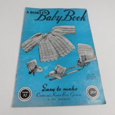 an old crocheted baby book with pictures of birds on the front and back cover