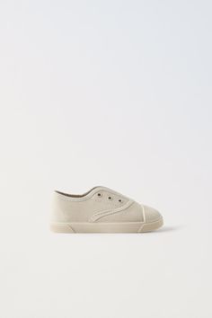 STRETCHY COTTON SNEAKERS - Off White | ZARA United States Slip-on Canvas Shoes With Rubber Sole And Closed Toe, Slip-on Sneakers With Elastic Laces And White Sole, Textile Sneakers With Rubber Sole, Closed Toe, Canvas Shoes With Rubber Sole, Canvas Slip-on Sneakers With Branded Insole And Round Toe, Canvas Slip-on Sneakers With Branded Insole, Canvas Sneakers With Rubber Sole, White Sneakers With Vulcanized Sole, White Vulcanized Sole Sneakers With Closed Toe