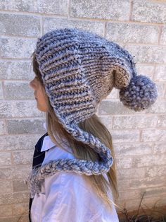 Fun and cozy slouchy, knit by me, beanie for the cooler fall and winter weather.  Ribbed knit split brim with smooth stockinette stitched body and large accent pom.  Yarn is a light gray color with small flecks of cream , tan, and dark brown.  80% acrylic and 20% wool blend. Care Instructions: Hand wash cold. Dry flat.  Carefully fluff/shake pom when dry to restore shape. Pattern: PixieBell Adjustable Soft Knit Cozy Bonnet, Slouchy Warm Hats For Fall, Warm Slouchy Hats For Fall, Cozy Adjustable Soft Knit Bonnet, Warm Winter Bonnet With Curved Brim, Cozy Adjustable Knit Beanie, Slouchy Hats For Cold Weather In Fall, Hand Knitted Brimmed Bonnet For Winter, Adjustable Knit Hats For Fall