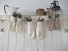 stockings hung on a wall with plants and spices