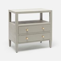 a grey nightstand with two drawers and gold handles