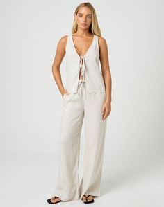 This linen straight leg pant features an adjustable tie waist closure. Linen Tie Waist Pants For Work, Workwear Linen Pants With Tie Waist, Linen Bottoms With Tie Waist For Work, Spring Linen Wide Leg Pants With Drawstring, Chic Linen Wide Leg Pants With Drawstring, Chic Linen Drawstring Bottoms, Straight Leg Pants With Tie Waist For Loungewear, Spring Loungewear Pants With Tie Waist, Linen Bottoms With Tie Waist And Straight Leg