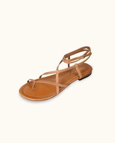 Crafted with delicate straps that elegantly secure your ankle while embracing the simplicity of a toe-strap design, these sandals are the essence of "boho chic" style. Elegant Ankle Strap Sandals For Vacation, Chic Adjustable Sandals With Heel Strap, Chic T-strap Sandals With Ankle Strap For Beach, Chic Ankle Strap T-strap Sandals For Beach, Chic Ankle-strap T-strap Sandals For Beach, Ankle Strap Sandals With Straps For Vacation, Chic Brown Adjustable T-strap Sandals, Chic Adjustable Open Toe Sandals, Chic Ankle-strap T-strap Sandals For Vacation