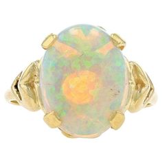 Size: 7 1/4 Sizing Fee: Up 2 sizes for $35 or Down 2 sizes for $30 Metal Content: 14k Yellow Gold Stone Information Natural Opal Carat(s): 3.73ct Cut: Oval Cabochon Stone Note: Australian Total Carats: 3.73ct Style: Cocktail Solitaire Features: Heart Shoulder Detailing Measurements Face Height (north to south): 9/16" (13.7mm) Rise Above Finger: 11/32" (8.7mm) Weight: 5.2 Grams Stamps: 14k Condition: Pre-Owned Professionally cleaned, polished, and tested to guarantee metal content. Luxury Hallmarked Oval Cabochon Opal Ring, Rise Above, La Face, Gold Stone, Natural Opal, Oval Cabochon, Solitaire Ring, Karate, Metallica