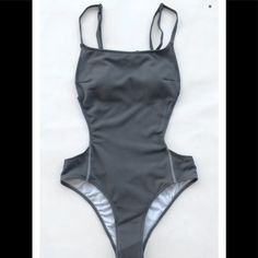 Brand New. Size: Medium. Color: Gray Gray Swimsuit, Gray Sleeveless Swimwear For Summer, Sleeveless Gray Swimwear For Summer, Gray Swimwear For Vacation And Beach Season, Gray Beachwear Swimwear For Summer, Gray Swimwear For Beach Season Vacation, Trendy Summer Gray Bodysuit, Fitted Gray Swimwear For Vacation, Gray Summer Beachwear Swimwear