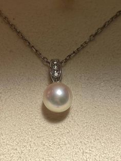 Offer is a amazing Mikimoto Akoya Pearl Pendant with diamonds. Pearl size is about 7.2-7.5mm, white color with strong pinkish overtone, mirror like luster.  Pendant and chain both have signature 'M' and '750' on the back. Setting is 18K YG. Neckalce is about 18inches long. Excellent condition with no sign of wear, come with original earrings box! This could be a great gift for Holiday season! Please reach out if you have any questions. Thanks for looking and don't forget to check out my other be Earring Box, Katy Tx, Akoya Pearls, Pearl Size, Pearl Pendant, Pendant Necklaces, White Color, Jewelry Necklace Pendant, Don't Forget