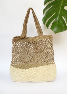 Stylish and on trend, this beautiful tote is handmade by artisans from Santander, Colombia. 100% made of Fique natural fiber, a plant similar to Agave, it is the perfect summer accessory to be used out in the city or to spend a day at the beach. With two easy to carry handles, you will want to carry it around everywhere you go!Approximate Dimensions:Height: 17" / 43 cmWidth: 16.1” / 41 cmStrap drop: 9"/ 23 cmAll of our bags are 100% handmade from natural fibers. Please allow for any color and si Boho Handbag, Handwoven Bag, Boho Handbags, Summer Tote, Raffia Bag, Handmade Baskets, Summer Bag, Market Tote, Bag Handmade