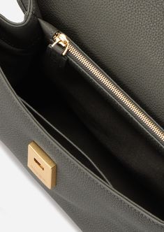 Inspired by Grace Kelly's enduring style, the Grace Soft Top Handle Bag is meticulously crafted from premium Italian full-grain pebbled calfskin leather, ensuring both durability and elegance. Its timeless and versatile design features a thoughtfully structured interior that comfortably accommodates all your everyday essentials. Combining style and practicality, this bag is the perfect choice for those seeking both elegance and functionality in their daily life. Timeless Epsom Leather Shoulder Bag With Gold-tone Hardware, Black Caviar Leather Evening Bag, Timeless Epsom Leather Satchel With Gold-tone Hardware, Classic Bag In Epsom Leather With Gold-tone Hardware, Epsom Leather Satchel Shoulder Bag With Gold-tone Hardware, Classic Bag With Gold-tone Hardware And Epsom Leather, Classic Formal Caviar Leather Bag, Elegant Bag In Textured Caviar Leather, Timeless Textured Leather Shoulder Bag For Business