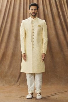 Cream sherwani with floral embroidery. Paired with cream churidar.
Component: 2
Pattern: Embroidered
Type Of Work: Floral
Neckline: Mandarin Collar
Sleeve Type: Full
Fabric: Sherwani: Art silk, Churidar: Dupion art silk, Lining: Faux satin
Color: Cream
Other Details: 
Note: The pocket square worn by the model is not for sale
Occasion: Wedding - Aza Fashions Semi-stitched Cream Sherwani With Zari Work, Cream Traditional Wear With Dabka For Festive Occasion, Off White Sherwani With Zari Work For Diwali, Cream Semi-stitched Sherwani With Zari Work, Semi-stitched Cream Bandhgala With Zari Work, Cream Sherwani With Resham Embroidery For Eid, Off White Zari Work Sherwani For Diwali, Cream Churidar With Naqshi On Straight Kurta, Semi-stitched Cream Bandhgala With Resham Embroidery