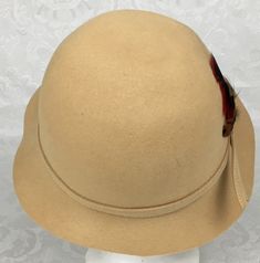 "Here we have a vintage Lord & Taylor 100% wool Adolfo II Beige Cloche Hat with feather millinery. The circumference is 21 1/2\". The Brim ranges from 1 3/4\" - 2 1/2\". I see no problems with this lovely Hat. I try my best to give accurate descriptions, although I am no expert, plus I'm human and sometimes I might miss a flaw. I always provide high resolution photos and consider them to be part of the description. I encourage you to zoom in and examine them closely as they show exactly what Vintage Wool Cloche Hat With Curved Brim, Vintage Wide Brim Fur Felt Hat, Vintage Wool Brimmed Cloche Hat, Vintage Beige Cloche Hat, Fitted Vintage Fur Felt Cloche Hat, Vintage Baby Girl, Baby Girl Dolls, Cloche Hat, High Resolution Photos