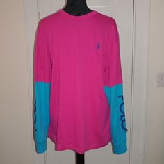 Polo Ralph Lauren: Pink & Blue Classic Fit Long Sleeve Crew T-Shirt Polo Script On Both Sleeves Blue Polo Pony Logo At Chest 100% Cotton Men's Size Medium New W/Tags Sporty Multicolor Long Sleeve T-shirt, Sporty Long Sleeve Pink Tops, Sporty Pink Long Sleeve Top, Blue Long Sleeve Color Block T-shirt, Pink Color Block Cotton T-shirt, Pink Relaxed Fit Color Block Tops, Pink Color Block Relaxed Fit Tops, Pink Color Block Tops With Relaxed Fit, Pink Cotton Sporty Shirt