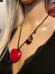 "Natural Red Jade, Bleeding Heart Necklace... With Blood Potion Bottle Red Jade The most Passionate and Stimulating Stone, A Stone of Love, and encouraging Love Energies.. Wear Red Jade to increase your Abundance, and Prosperity.. Leadership skills enhanced.. Ultimate Protection Their beautiful Natural Red Jade Is Big, measures 40mm The Black Stainless Steel Chain ( adjustable ) Measures 26\" With Glass.. Blood Drops" Handmade Red Heart Cut Jewelry, Red Heart Pendant For Jewelry Making, Red Heart Beads Pendant Jewelry, Red Double Heart Jewelry For Jewelry Making, Handmade Red Heart-shaped Jewelry, Red Adjustable Heart Pendant Necklace, Red Adjustable Heart-shaped Necklace, Red Heart-shaped Adjustable Necklace, Red Adjustable Heart Necklace