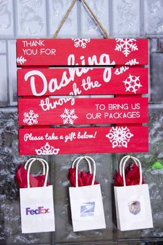 three bags hanging from a sign that says, thank you for dancing in the snow to bring us our packages