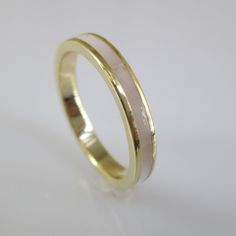 Stunning Genuine Mother Of Pearl Inlay Band. This One Is 14kt. Gold Over Sterling Silver, Just Beautiful How It Glistens! The Mother Of Pearl Is Of A Polished Slightly Off White Color, So Pretty! Face Height = 3mm. Subtle Elegance. Makes A Great Wedding Band, Thumb Ring, Or Any Finger Ring! Wear It Solo Or Stack Them Up! Stamped 925. This Listing Is For One Ring, Other Items Are Display. Mother Of Pearl Wedding Band, Pearl Wedding Band, Brushed Gold Ring, Summer Ceremony, Pearl Wedding Bands, 2025 Wedding, Mother Of Pearl Inlay, Pearl Inlay, Gold Rings Jewelry