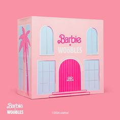 a pink barbie dollhouse with the words barbie on it