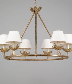 a chandelier with five lamps hanging from it