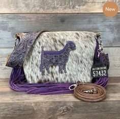 💜Purple Match! 💜Mini Designer & a Buckaroo! 👉Jump to the website here ----> http://ow.ly/PtIK50MERjG . . . . . . . . #westernpurse #westernfashion #bestwesternpurse #leathertote #leatherbag #haironhidebag #bohofashion #yellowstonefashion #texasfashion #rodeofashion #missrodeofashion #westerninfluencer #bestwesternpurse #westerncouture #western #holycowcouture #hcc #leatherfashion #ofy #purple Perfect Style, Purses Designer