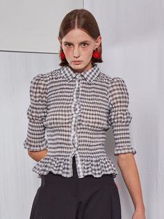 Editor's NotesThis long sleeve blouse in gingham check has slender silhouette with volume addressing classic feminine mood. Style with any simple bottoms creating lovely casual outfit.- Gingham check patterned fabric- Smocking detail all around body and lower sleeves- Puffy shoulders and flared sleeve hem- Flared hem line- Center front button down closureMeasurements(in.)One Size (XS-M)- Shoulder: 12.60 in.- Chest: 10.63 in.- Sleeve Length: 13.78 in.- Total Length: 20.47 in.*Model info: Height: 5' 8.5, Bust 30, Waist 24, Hip 35Composition & Care- 41% Rayon, 34% Nylon, 25% Polyester- Dry cleaning onlyDesigner- by FABER FINGER Summer Workwear Smocked Top With Smocked Cuffs, Chic Gingham Top With Smocked Bodice, Spring Chic Gingham Smocked Top, Summer Smocked Top With Smocked Cuffs For Work, Spring Gingham Smocked Top, Chic Plaid Tops For Office, Fitted Gingham Blouse With Puff Sleeves, Chic Plaid Puff Sleeve Tops, Fitted Gingham Top With Smocked Bodice