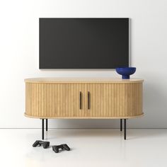 an entertainment center with a television mounted on the wall