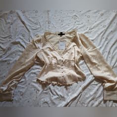 Make An Offer! Cute Button Up Long Sleeve Top In A Cream Color. Silky Material And So Pretty, Nwt. Tags: Long Sleeve, Shirt, Top, Blouse, Satin, Cream, 70s, Buttons, Lace Fitted Tops With Pearl Buttons, Feminine Fitted Top With Buttons, Feminine Fitted Tops With Buttons, Feminine Fitted Buttoned Top, Fitted Feminine Top With Buttons, Fitted Button-up Blouse With Pearl Buttons, Chic Button-up Tops With Pearl Buttons, Spring Night Out Top With Button Closure, Feminine Tops With Buttons For Night Out