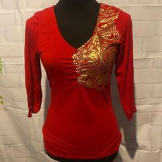 Nwot Dereon Beyonc Top Red In Color Worh Gold Dereon Symbol Size Small~Tts Half Sleeves Open Back Tags:Bright, Open, Gold, Fashion, Beyonc, Trendy, Casual, Style, Youth, Women Stretch Long Sleeve Tops For Festive Occasions, Festive Long Sleeve Stretch Tops, Fitted Casual Top For Festive Occasions, Festive Red V-neck Top, Fitted Red Top For Festive Season, Summer Festive Stretch Tops, Festive Stretch Tops For Summer, Festive Red Long Sleeve Top, White Short Sleeve Tops