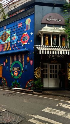 a colorful building on the corner of a street