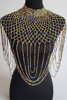 "This shoulder necklace is 100% handmade. Perfect for weddings , African themed events, cultural events or any other event. The list is endless.... Color; multicolor. Size; 22\" long for the longest strand. 16\" around the neck. **Buy multiple items and pay shipping for 1 item only.The rest ships free. More neckleces here; https://www.etsy.com/shop/TribalTess?ref=seller-platform-mcnav&section_id=21306083 Back to my shop; https://www.etsy.com/shop/TribalTess?ref=seller-platform-mcnav" Multicolor Beaded Chain Necklace For Wedding, Multicolor Beaded Necklace For Wedding, Handmade Multicolor Bridal Necklace With Round Beads, Wedding Multicolor Beaded Chain Beads, Bohemian Multicolor Beaded Necklaces For Wedding, Bohemian Multicolor Beaded Necklace For Wedding, Multicolor Large Beads For Wedding, Multicolor Beaded Bridal Necklace For Party, Bohemian Multicolor Bridal Necklace For Party